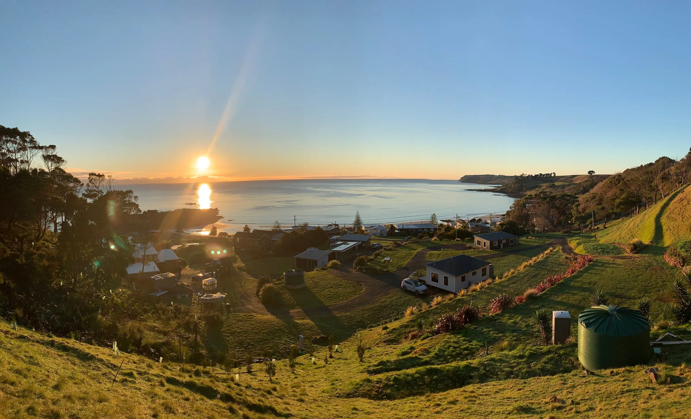 Sunrise over Boat Harbour Beach Holiday Park and the bay